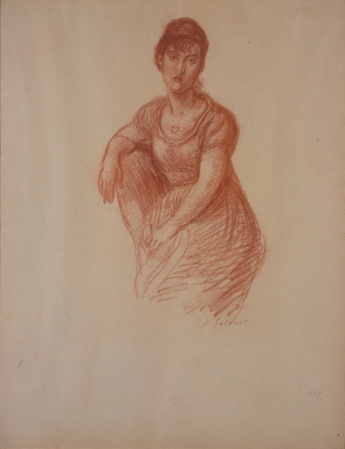 Woman sitting in an armchair