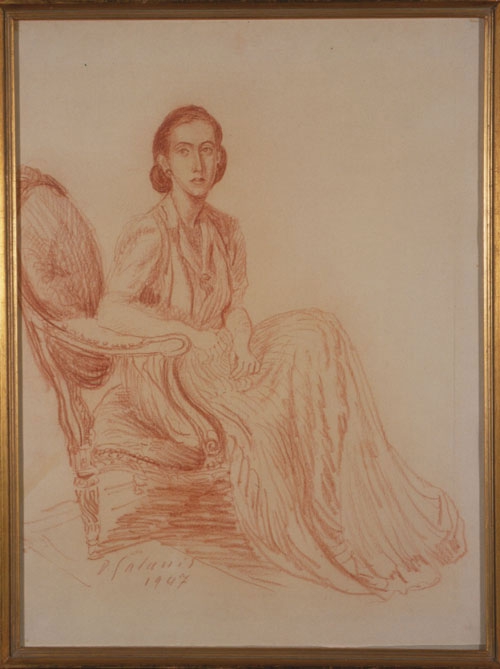 Woman sitting in an armchair